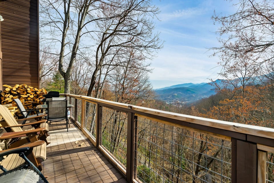 Main level deck with outdoor sitting area and gas grill