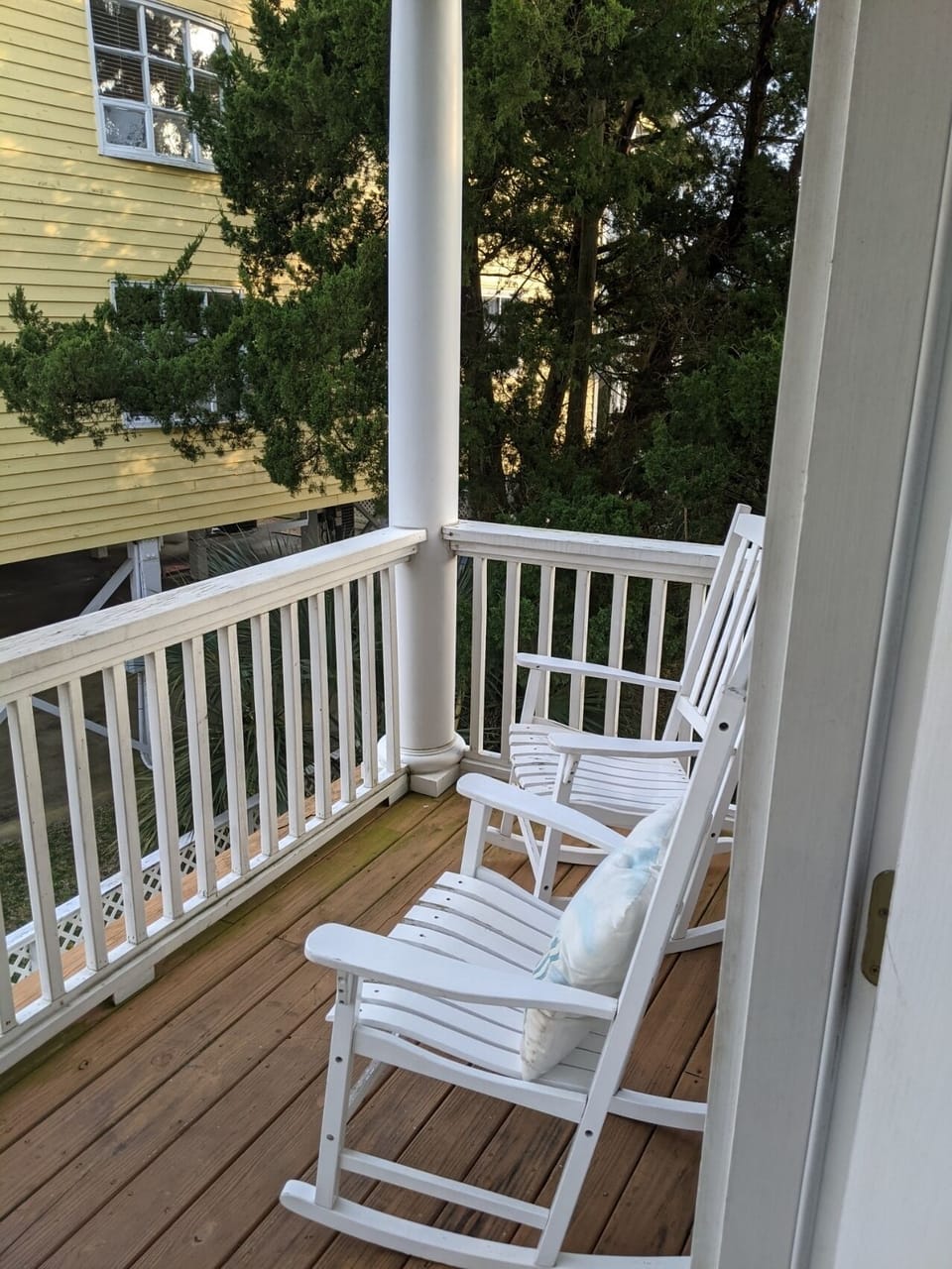 Balcony with rocking chairs just off the den.