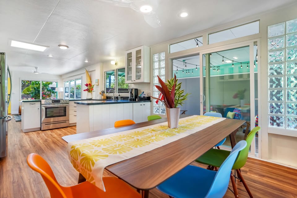 Dining area is close to kitchen and outdoor lanai lounge.