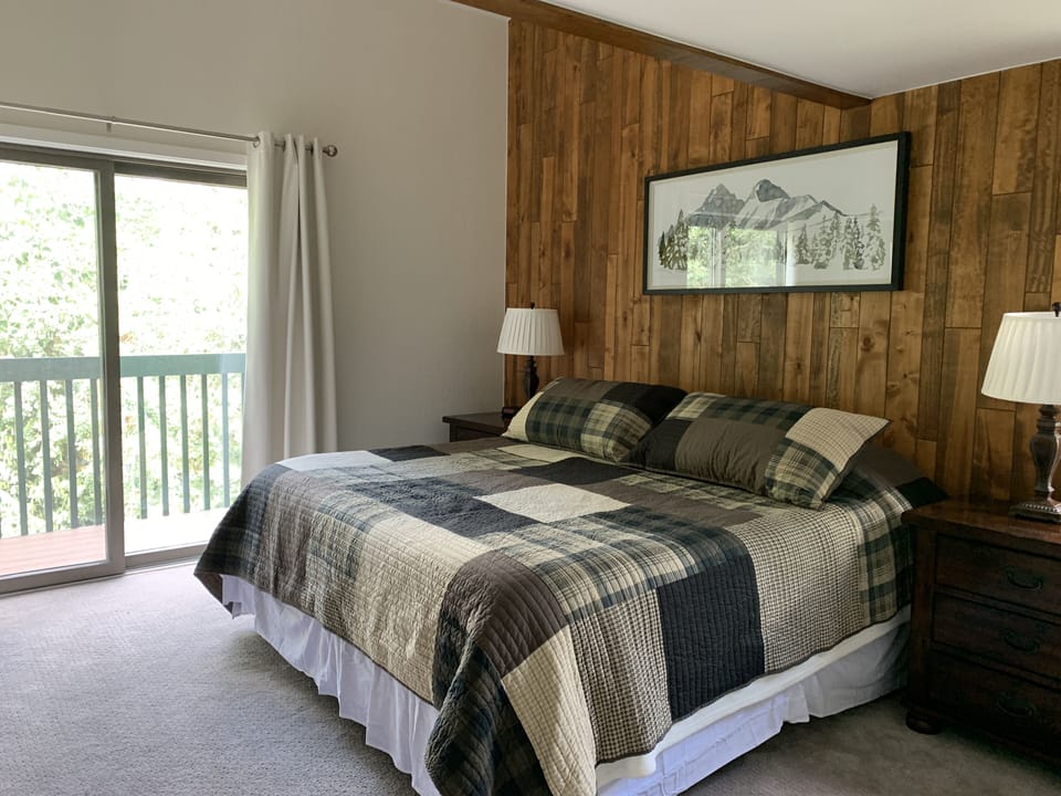 Large master bedroom with king size bed and optional desk (not shown)