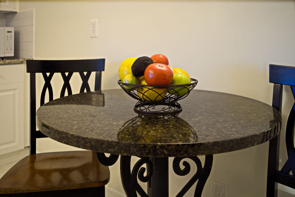 Kitchen eating area for two and local produce, in season