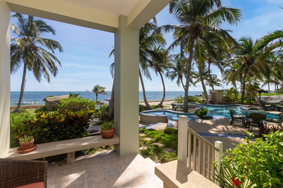 Large patio with ocean, beach and pool views