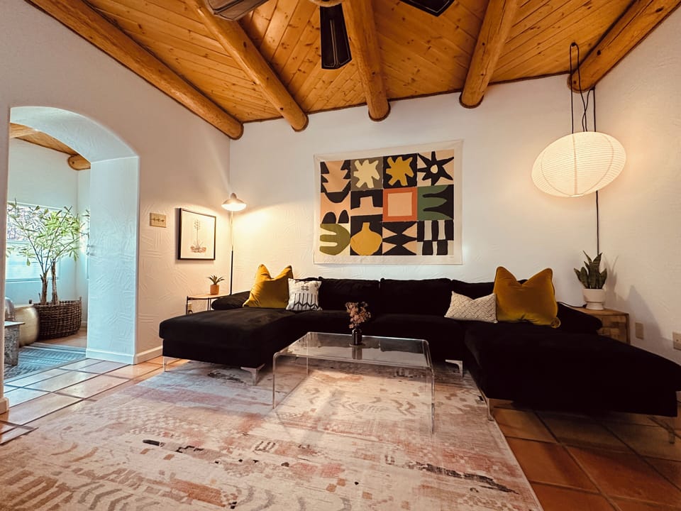 Living Room w/ double chaise sofa, viga ceilings and Smart TV