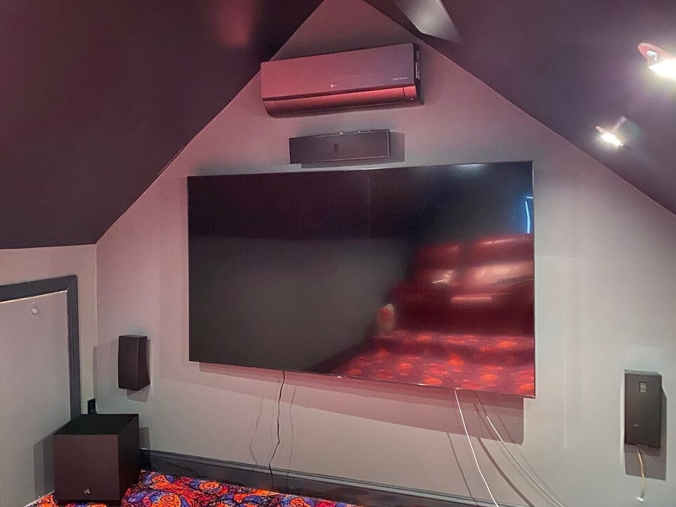 Theater Room with 85” 4K TV.  Surround sound system. 