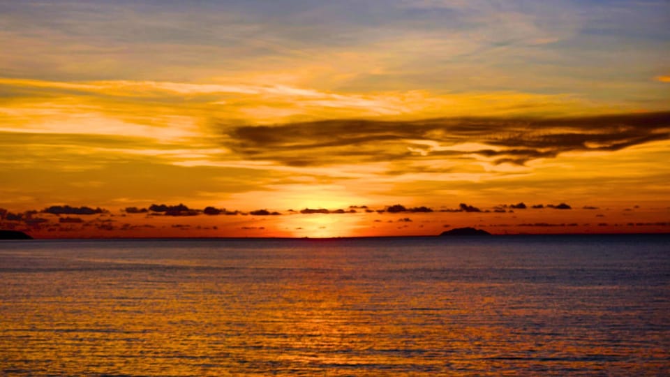 Watch the sun set beautifully behind Desecheo Island.