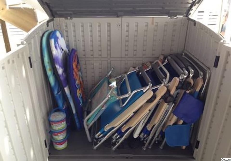 Beach chairs, boogie boards, umbrella, and beach toys are available to use