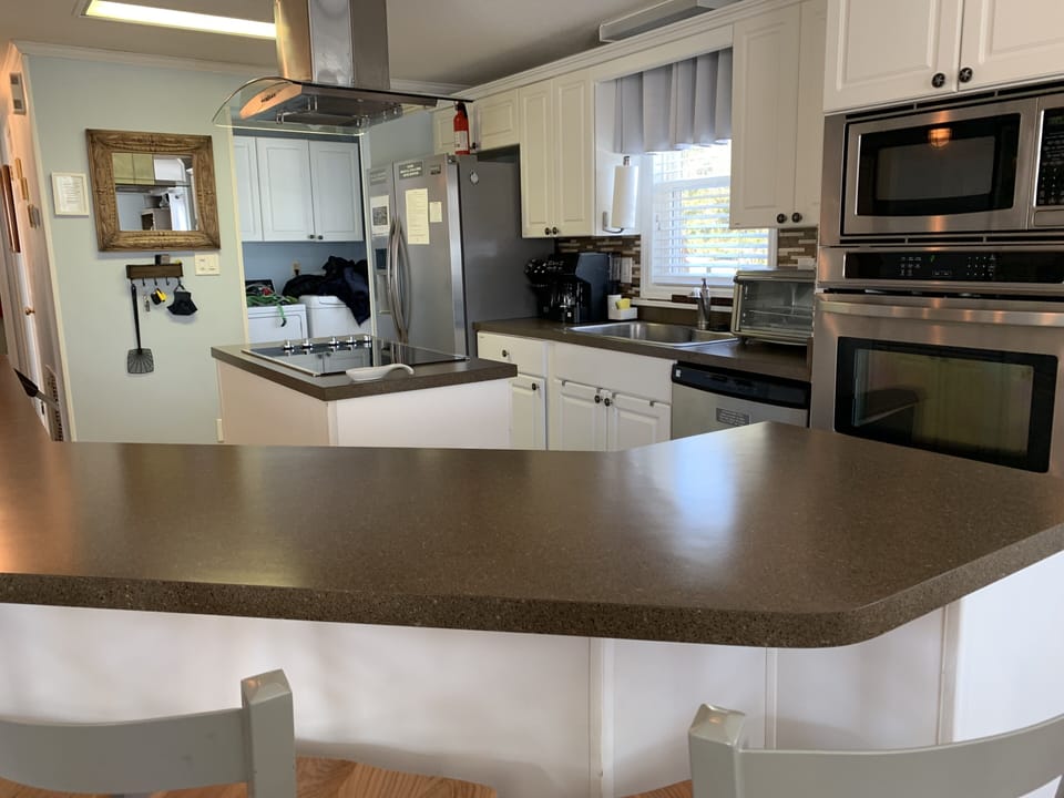 Open kitchen with stainless appliances