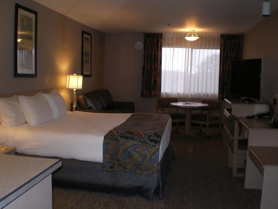 Relax in the cozy room with soft lighting and seating.