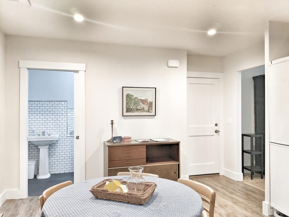 view of entranceway and bath from kitchen