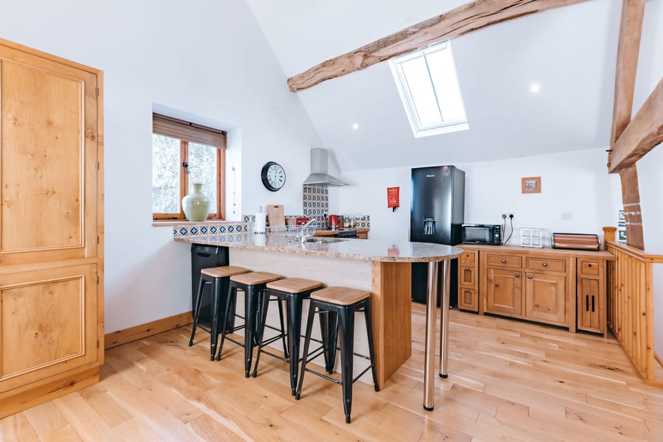 hay barn upstairs open plan kitchen dining living area with fully fitted kitchen