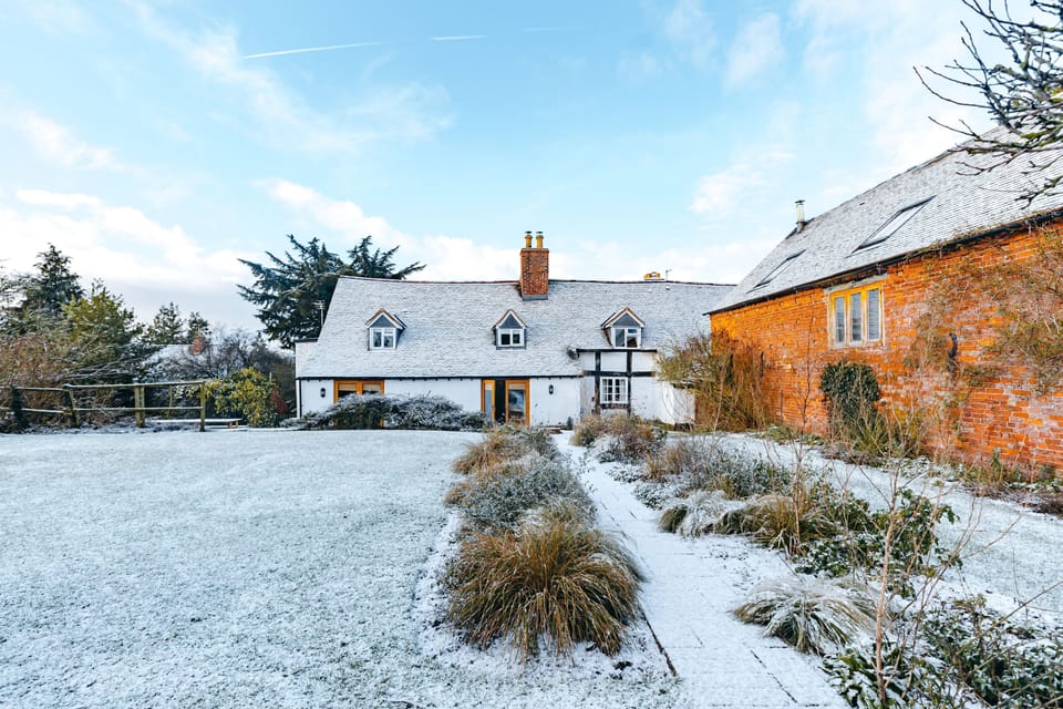 main house view of back, garden  and hay barn to side