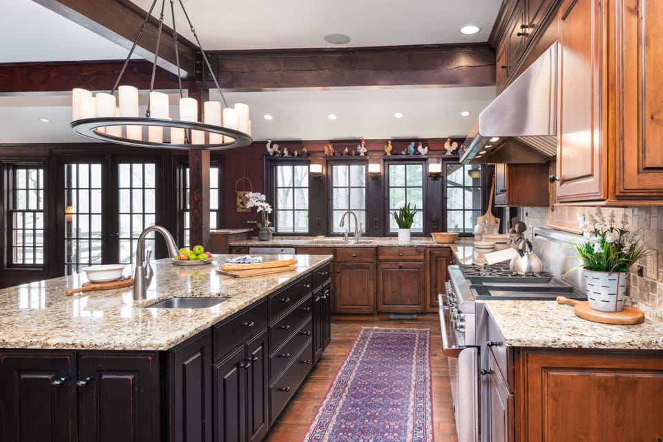 Stainless steel appliances, granite countertops, two ovens, prep and deep sinks.