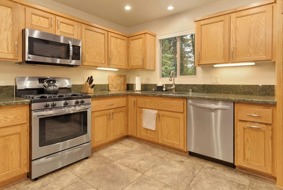 Spacious kitchen with modern appliances and ample counter space, perfect for cooking, entertaining, and family meals.