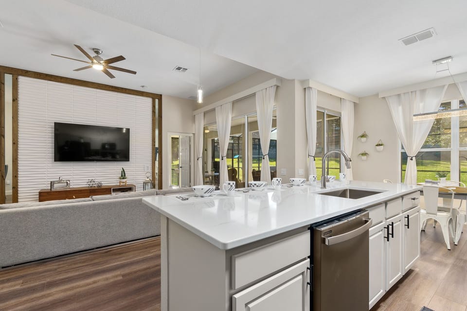 Open concept w/ sliding glass doors to pool