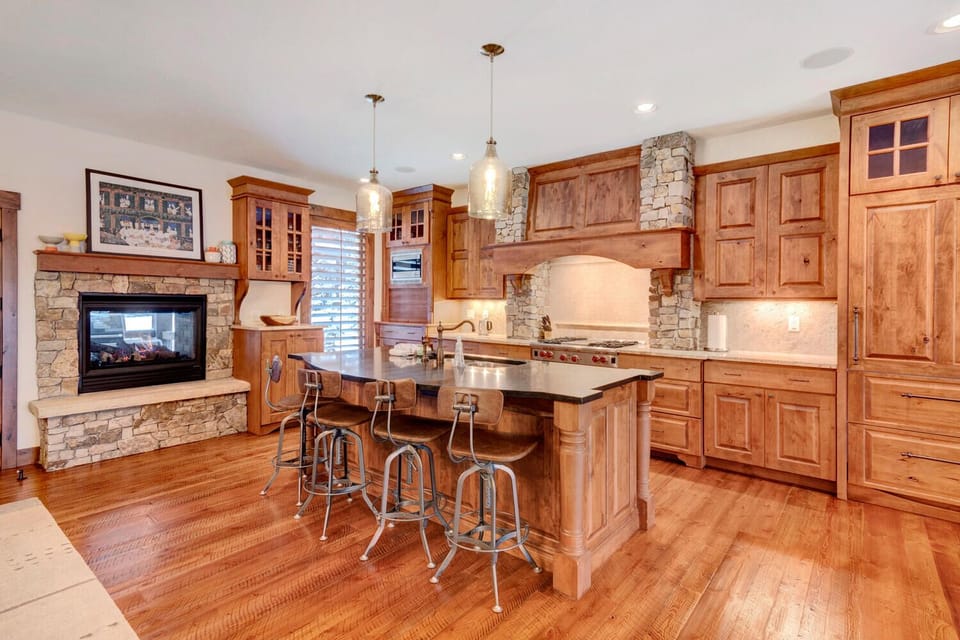 Expansive kitchen with indoor/outdoor gas fireplace