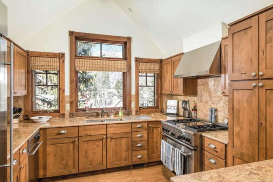 High end appliances and well stocked kitchen. 