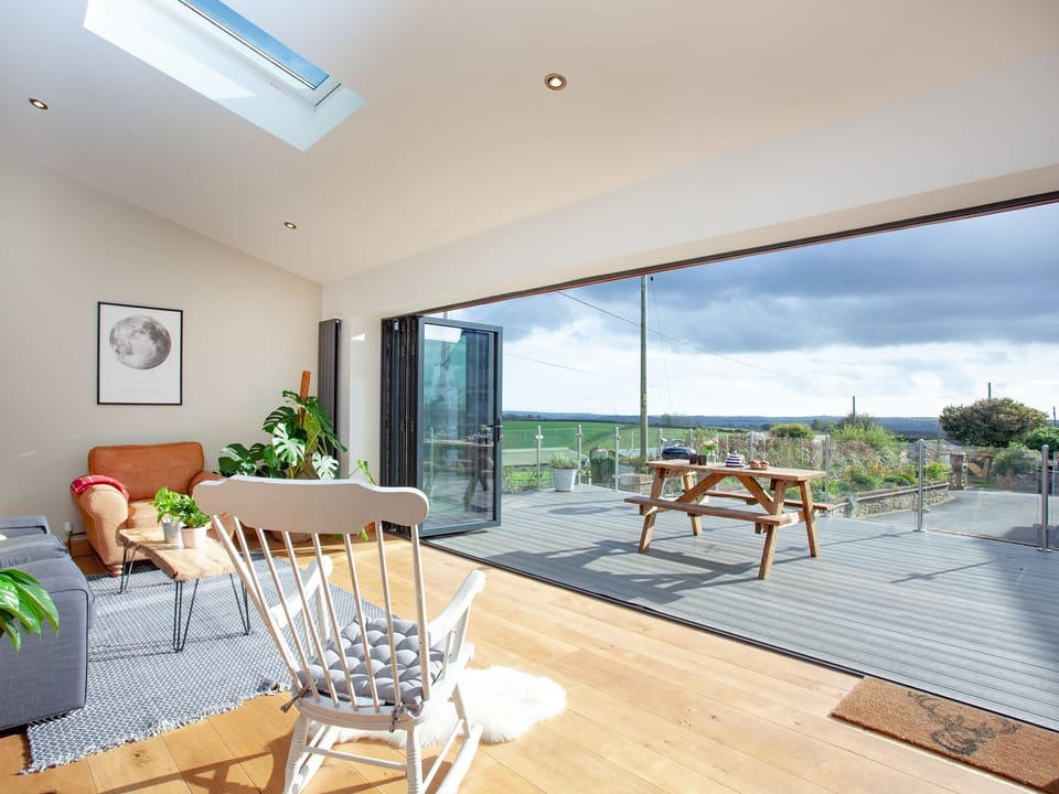 Living area with folding doors to patio area | Vredehoek, Blunts, near Saltash