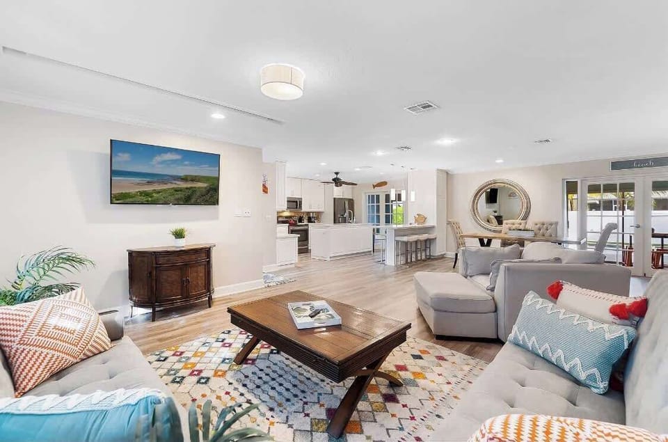 Luxurious open concept living area with smart TV