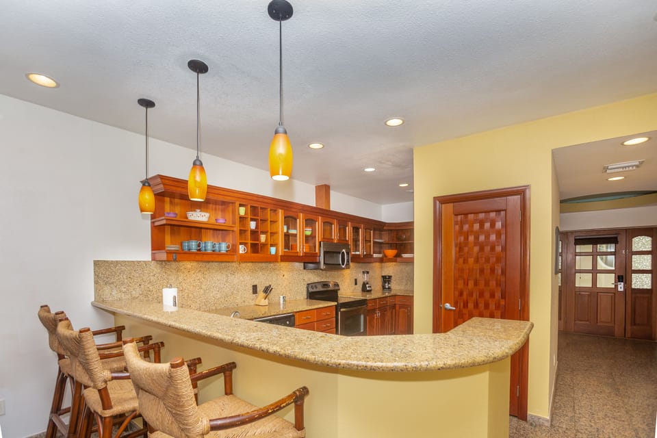 The kitchen has a breakfast bar for additional seating