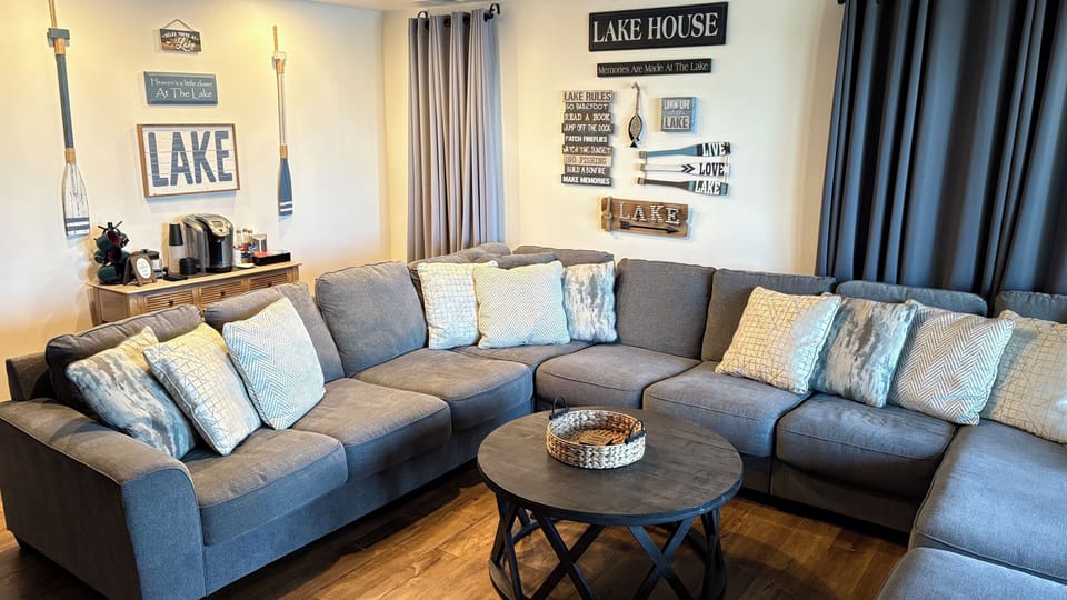 Comfortable sofa seating makes for cozy movie nights or sips from the coffee bar