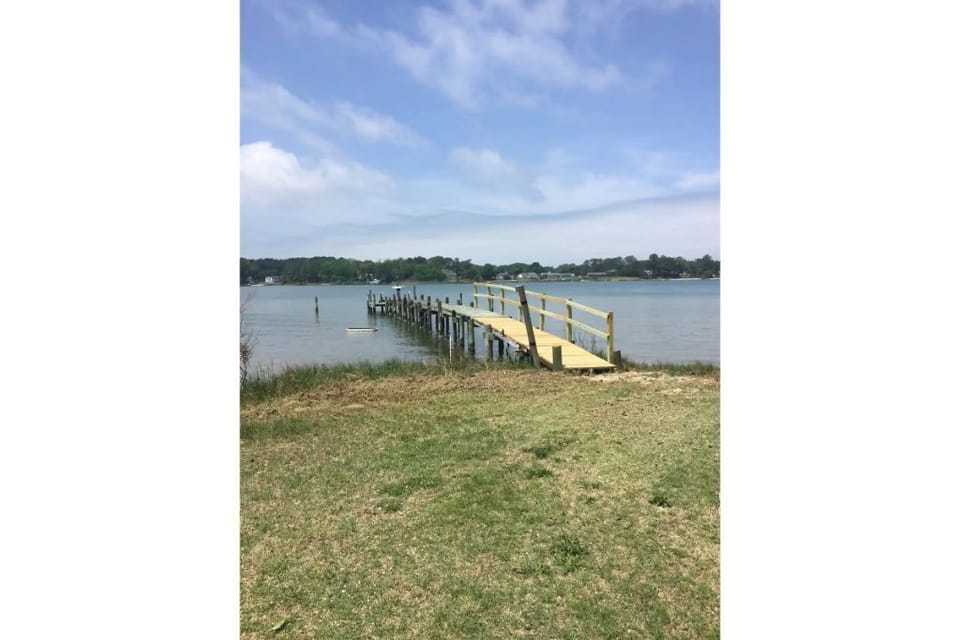 There is a long dock on the property with two boat slips for the boat owners.