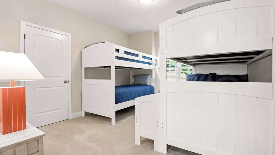 First floor guest room with 1 full and 3 twin beds