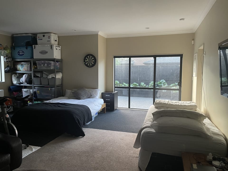 view of garage with beds, out to outside area