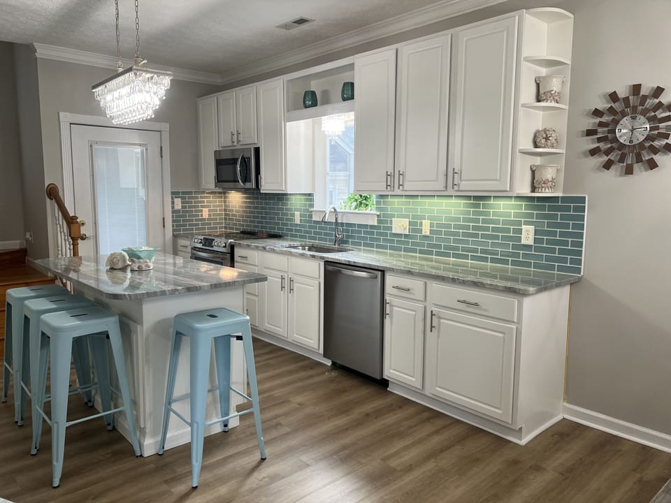 Glass back splash with crystal chandelier