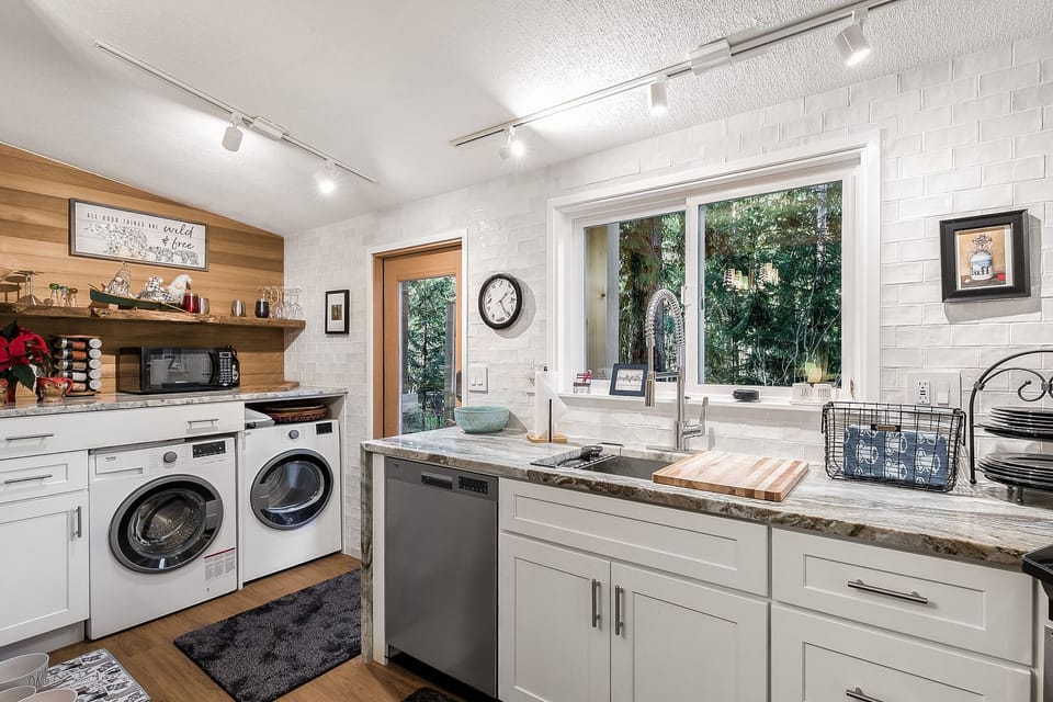 Washer/ dryer at the back entrance ideal after your Cascade mountain adventure.