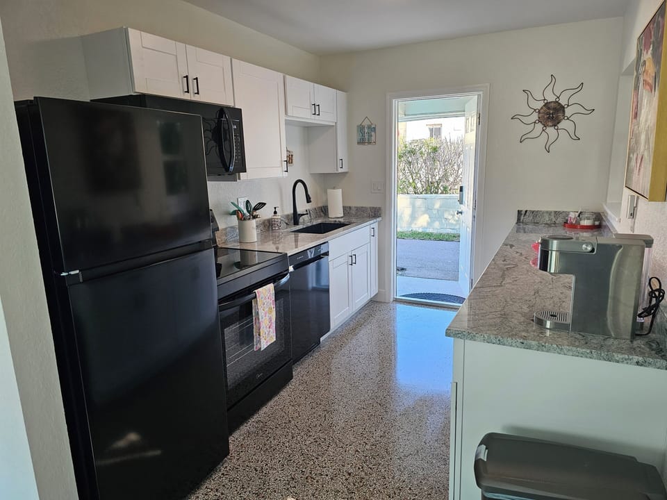 Galley Kitchen with brand new cabinets, granite & appliances  