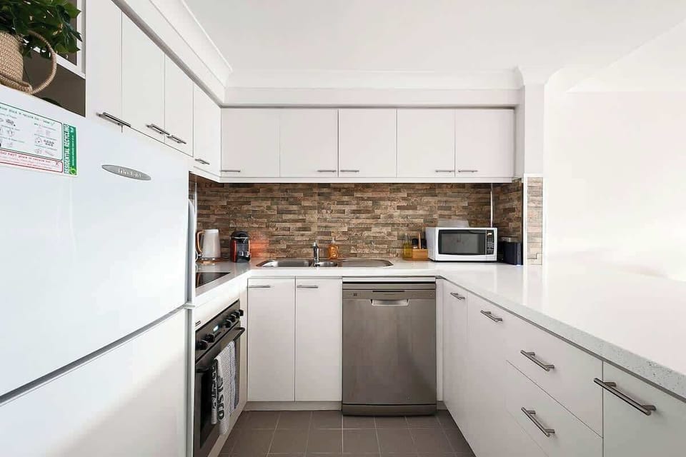 From quick breakfasts to gourmet dinners, this kitchen has everything you need. Enjoy the convenience of a full-size refrigerator, stove, oven, microwave, and dishwasher, making meal prep and cleanup a breeze.