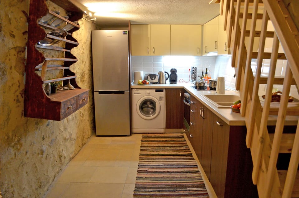 Equipped kitchen of beautiful stone built house short drive to south coast beaches