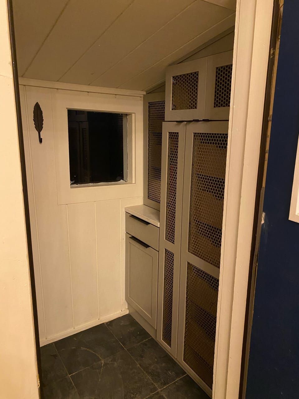 Small entrance with plenty of cabinets for gear storage.