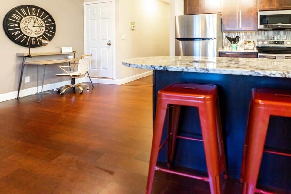Business guests can work on the sleek office desk off of the kitchen.