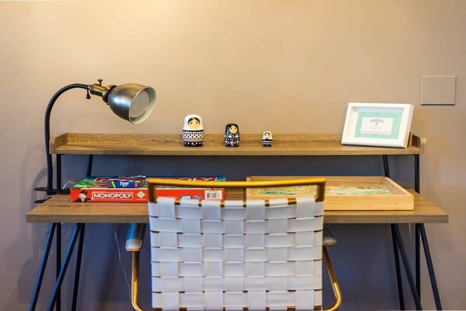 Business guests can work on the sleek office desk off of the kitchen.
