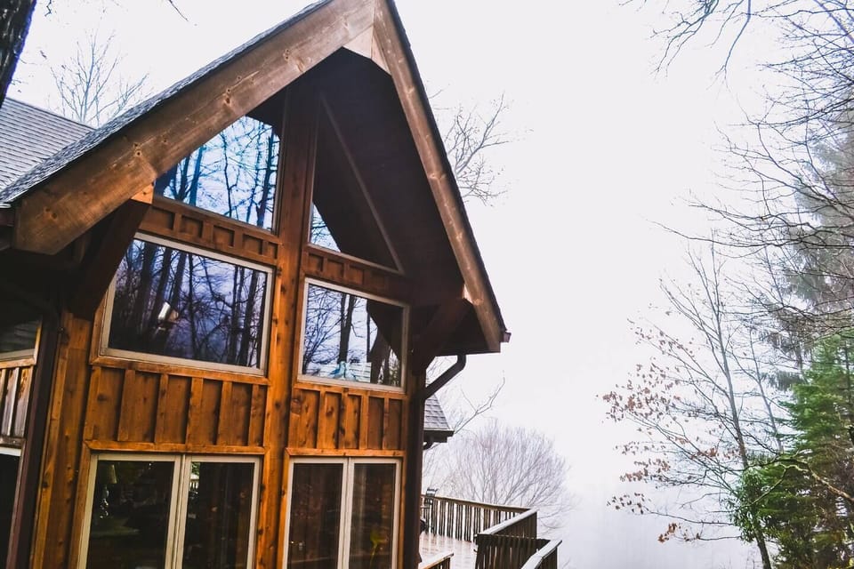 As the season's first snowstorm comes rolls in, the home welcomes guests with warm fires and beautiful views of nature. 