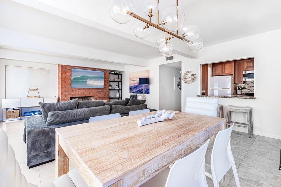 View from the dining area to the living area and kitchen.
                