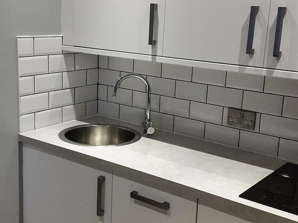 Kitchenette with sink and hob