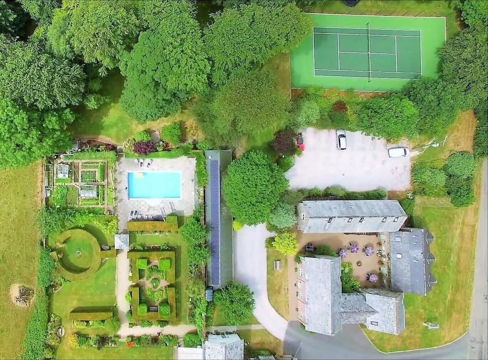 Overview of Tennis Court, Courtyard Area and Heated Pool