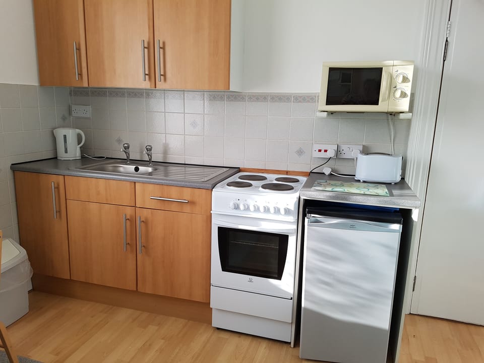 Fully equipped kitchen area - Flat 1