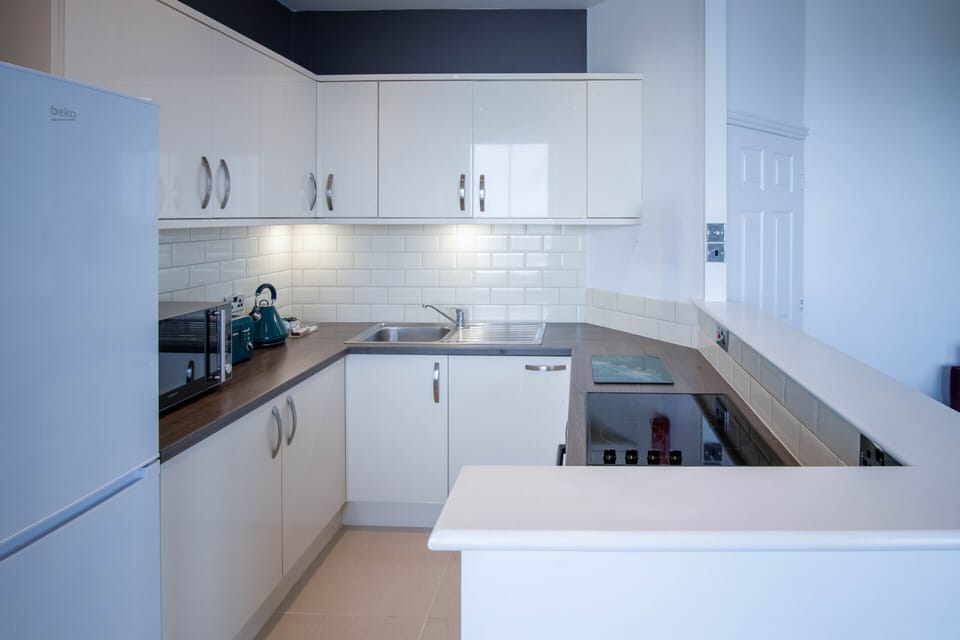 Open plan lounge, kitchen and dining room with stunning sea views