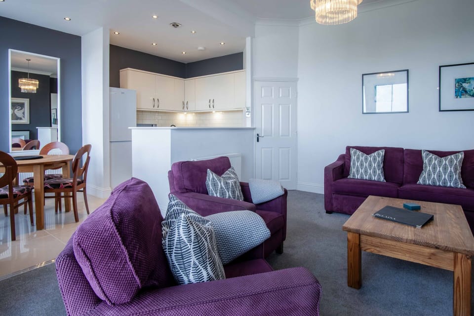Open plan lounge, kitchen and dining room with stunning sea views