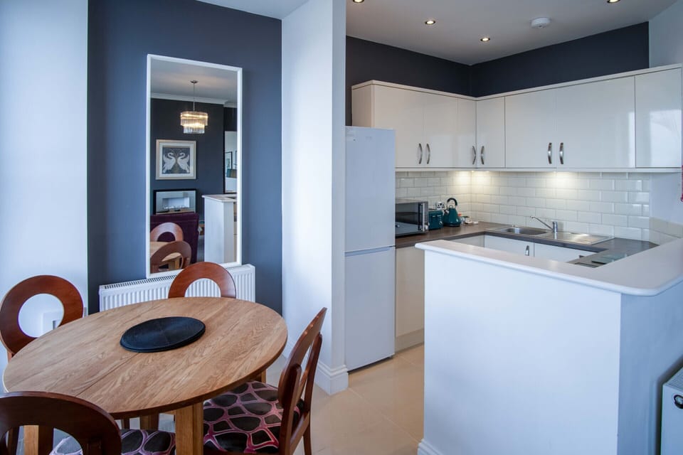 Open plan lounge, kitchen and dining room with stunning sea views