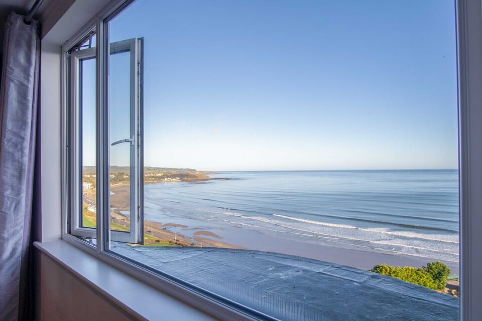Sea View Penthouse Suite with super king bed, lounge area and amazing sea views