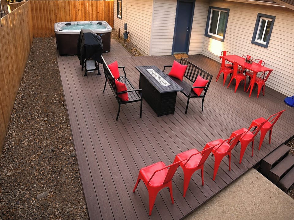 Spacious deck with fire table, hot tub, grill & family fun