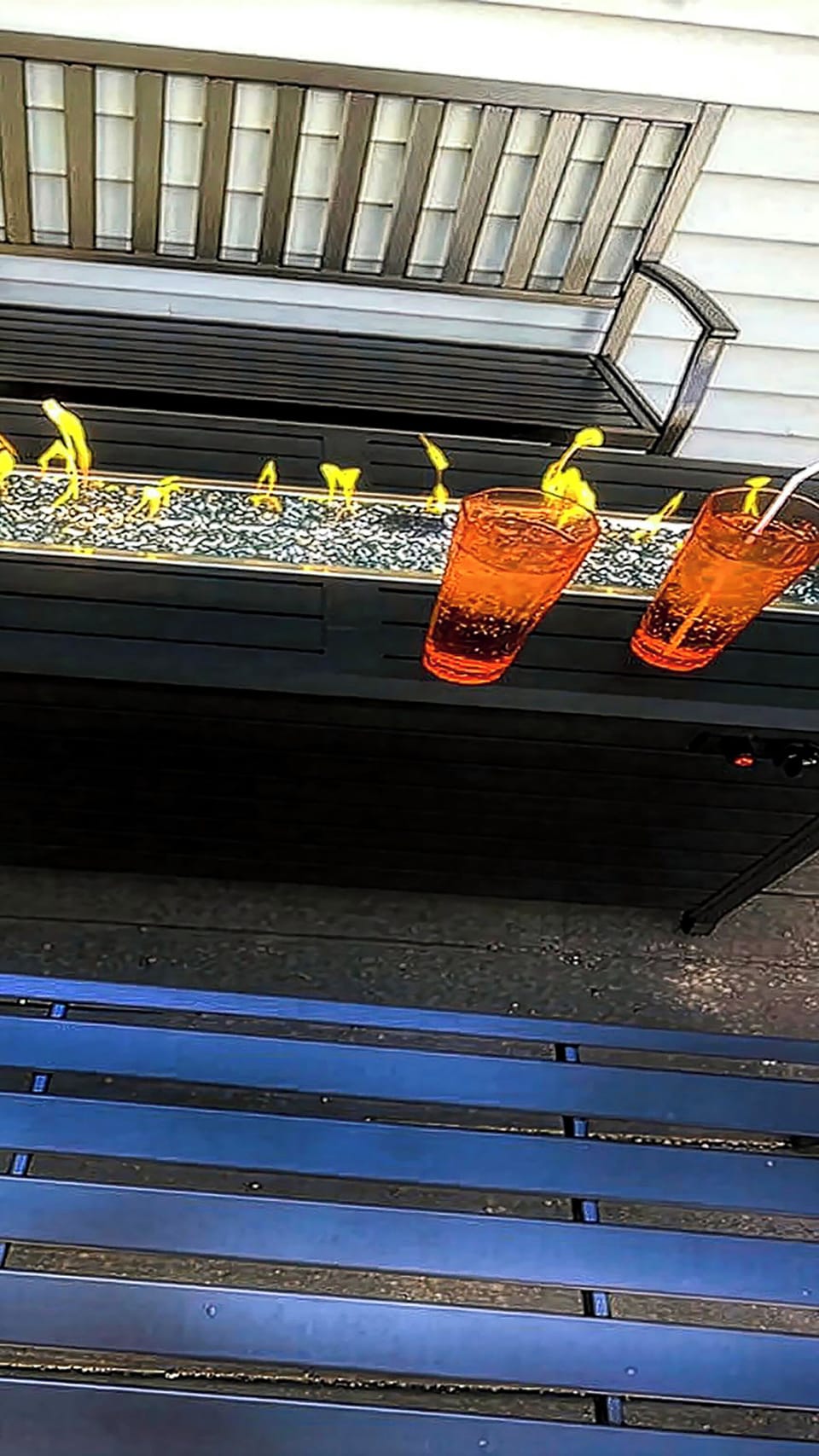 Sleek fire-pit table on the patio—ideal for evening drinks & chats.