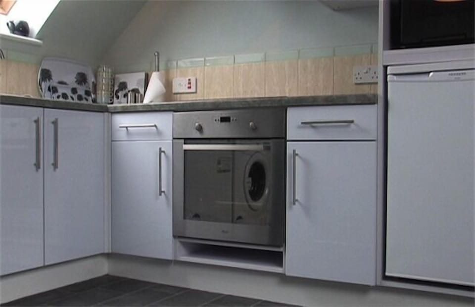 Loft Apartment kitchenette with dishwasher, washing machine, oven and fridge