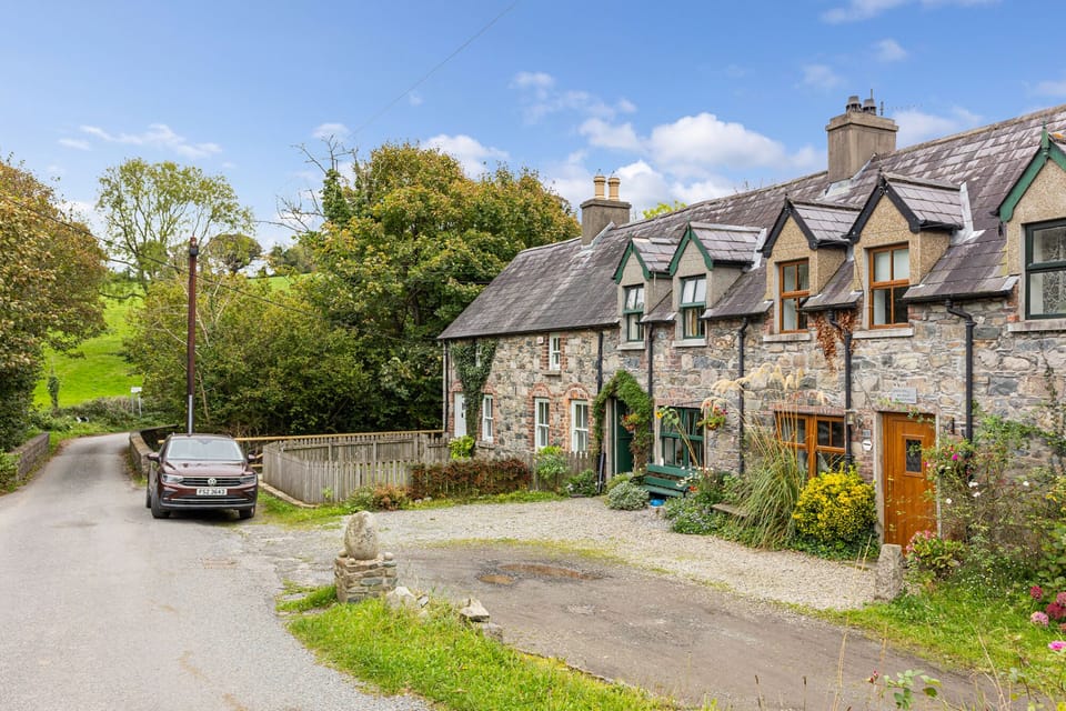 Looking back at Priest Bridge Cottage showing road bridge