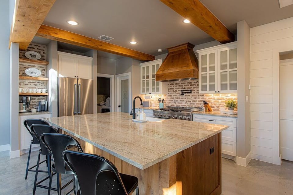 Large island kitchen overlooking great room. Coffee bar.
