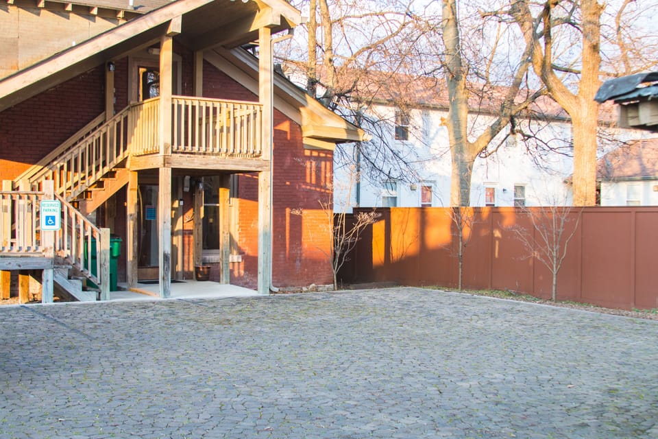 Apt.entrance and parking area accessed from alley behind the house, entrance is upstairs from rear of house, office on main level